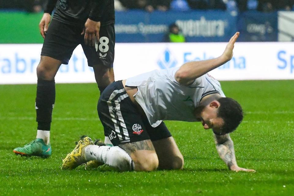 Gethin Jones reacts to a missed opportunity at Wanderers this season <i>(Image: Camerasport)</i>