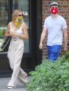 <p>Sienna Miller and Tom Sturridge mask up for a stroll around N.Y.C. on Tuesday.</p>