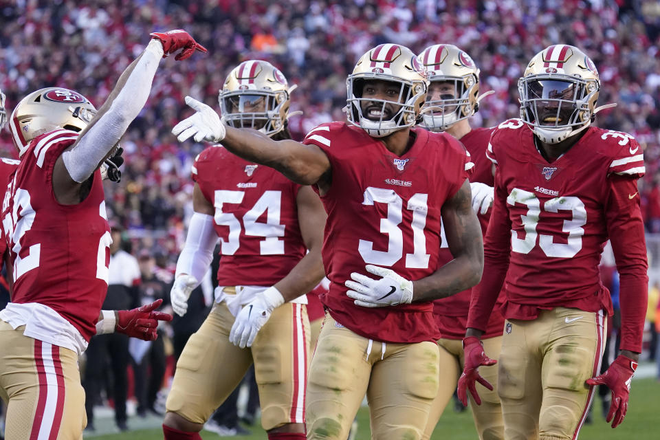 San Francisco 49ers' Raheem Mostert (31) celebrates with teammates after recovering a fumble against the Minnesota Vikings during the second half of an NFL divisional playoff football game, Saturday, Jan. 11, 2020, in Santa Clara, Calif. (AP Photo/Tony Avelar)