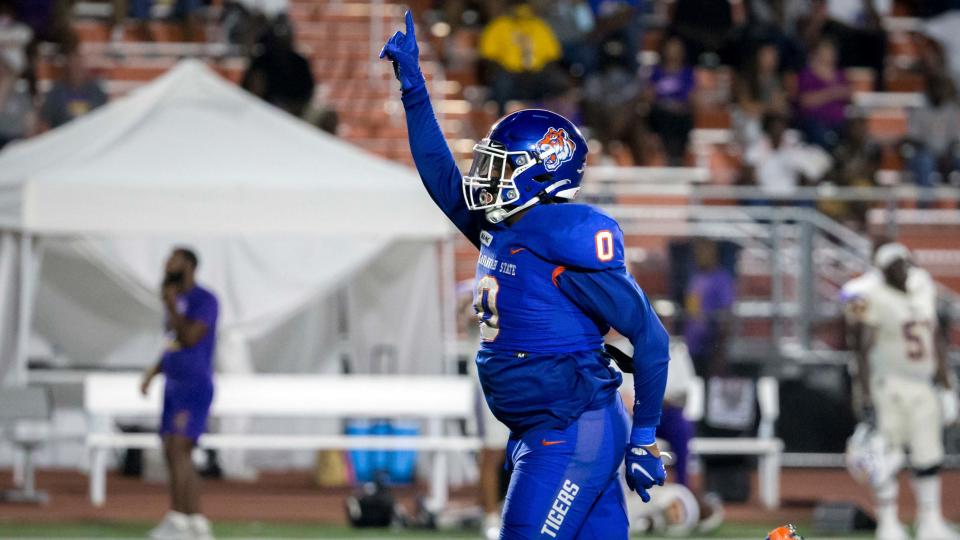 Savannah State defensive end Makenly Newbill celebrates after a tackle during the Sept. 18, 2021 game against Benedict College at T.A. Wright Stadium. 