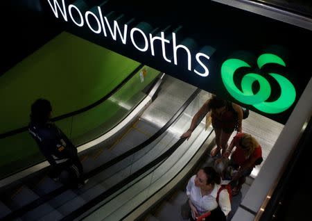 FILE PHOTO - Customers leave a Woolworths supermarket in central Sydney February 25, 2011. REUTERS/Daniel Munoz/File Photo
