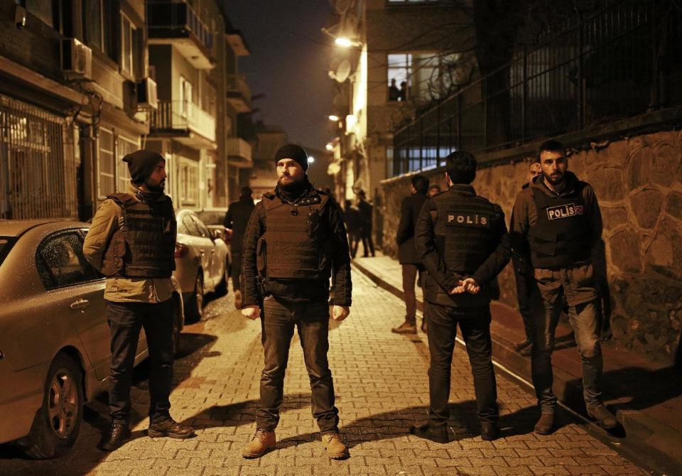 Turkish police officers secure a road near Istanbul's main police headquarters, Friday, Jan. 20, 2017. A Turkish media report says a rocket-propelled grenade was fired near the headquarters but that it missed the building. There was no further information on the incident, which comes at a time when Turkey has suffered a series of deadly attacks carried out either by the Islamic State group or Kurdish militants. (AP Photo/Emrah Gurel)