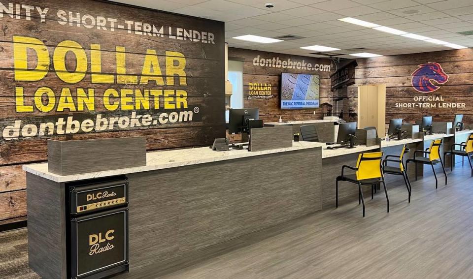 The Boise State Broncos logo is prominently displayed at the front desk of the Dollar Loan Center’s store in Boise as part of a sponsorship the payday lender has with Boise State Athletics.