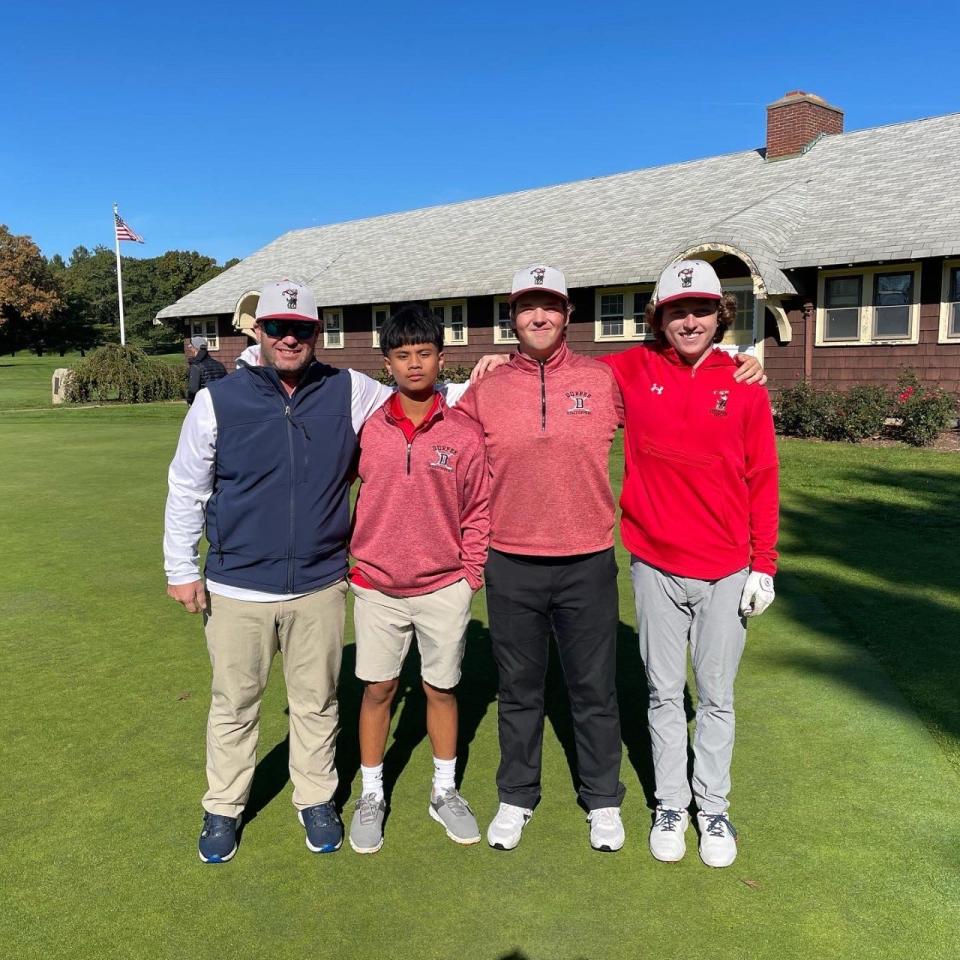 Durfee head coach Michael Hunsinger, left, stands with his golfers (from left to right) Ethan Tho, Mike Banalewicz and Brady Sullivan after Tuesday's Sullivan Memorial tournament in Brockton.