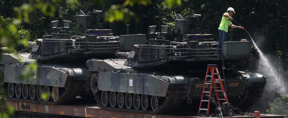 WASHINGTON, DC - JULY 02: A worker washes one of two M1A1 Abrams tanks that are loaded on rail cars at a rail yard on July 2, 2019 in Washington, DC. President Trump asked the Pentagon for military hardware, including tanks, to be displayed during Thursdays July 4th Salute to America celebration at the Lincoln Memorial. (Photo by Mark Wilson/Getty Images)