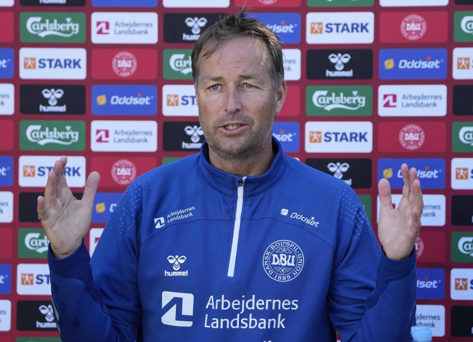 Denmark's manager Kasper Hjulmand talks to the media prior a training session of Denmark's national team in Helsingor, Denmark, Tuesday, June 15, 2021. It is the second training of the Danish team since the Euro championship soccer match against Finland when Christian Eriksen collapsed last Saturday. (AP Photo/Martin Meissner)