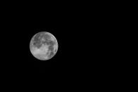 A view of the supermoon is also called the "super pink moon" seen in the sky, in Lhokseumawe, 8 April 2020, Aceh, Indonesia. The supermoon is a phenomenon when the moon is estimated to be at a distance of 356,910 kilometers from Earth. (Photo credit Fachrul Reza/Barcroft Media via Getty Images)