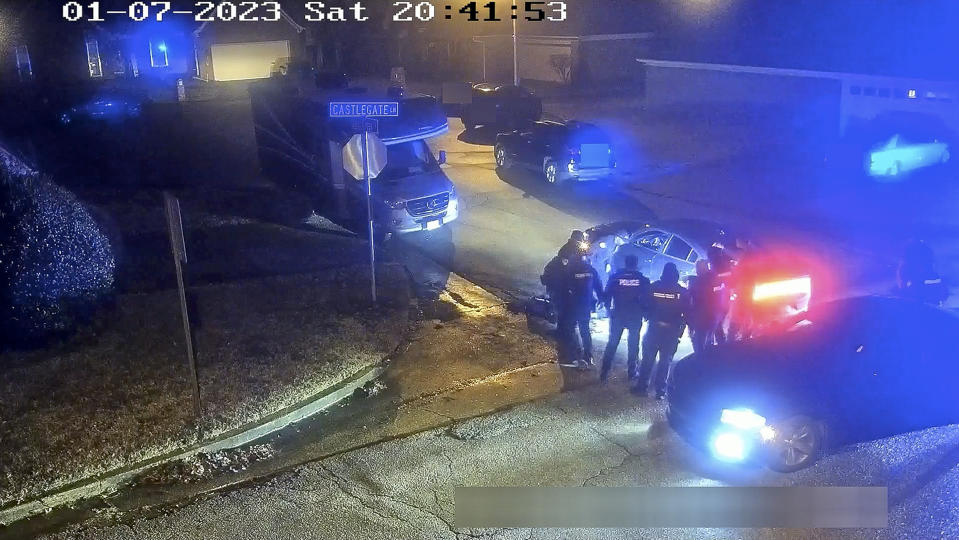 The image from video released on Jan. 27, 2023, and partially redacted by the City of Memphis, shows Tyre Nichols seated leaning against a car during a brutal attack by five Memphis police officers on Jan. 7, 2023, in Memphis, Tenn. Nichols died on Jan. 10. The five officers have since been fired and charged with second-degree murder and other offenses. (City of Memphis via AP)