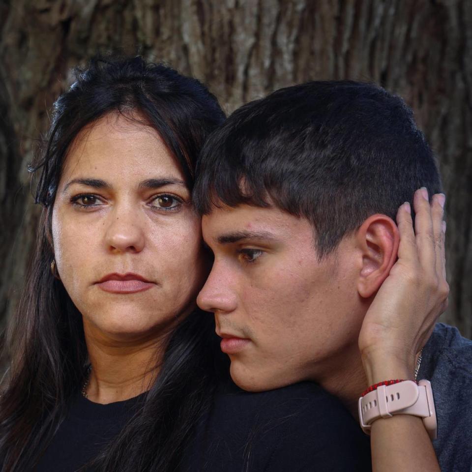 Yelaine Gonzalez, left, and son, Abdiel Benitez, right, are among thousands of recently arrived Cubans who who will not be able to obtain permanent U.S. residency because of the paperwork federal authorities gave them when they arrived.