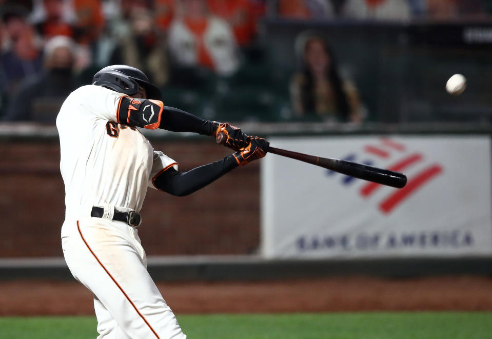 SAN FRANCISCO, CALIFORNIA - JULY 29:  Mike Yastrzemski #5 of the San Francisco Giants hits a walk off home run in the ninth inning against the San Diego Padres at Oracle Park on July 29, 2020 in San Francisco, California. (Photo by Ezra Shaw/Getty Images)