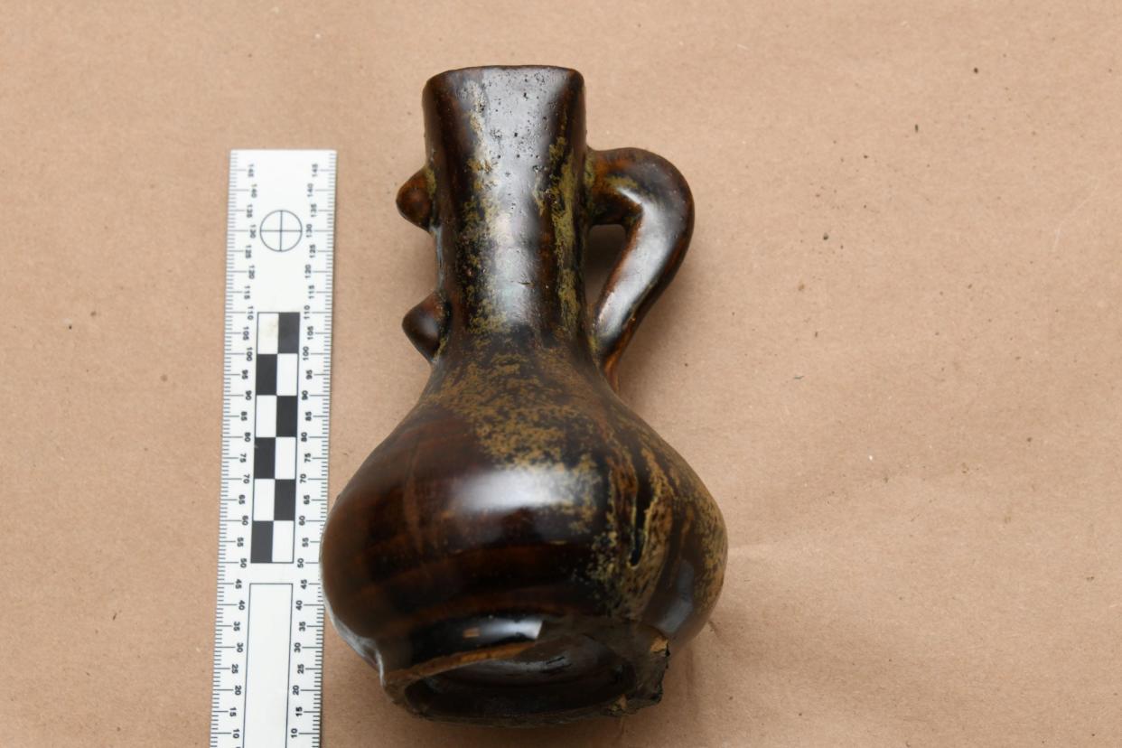 A jug with a handle. Since its inception, the FBI Art Crime Program has helped recover more than 20,000 items valued at over $900 million.