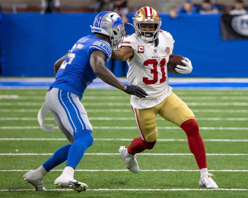 Then-49er Raheem Mostert runs with the ball on Sept. 12, 2021, against the Lions.
