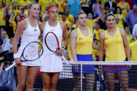 Tennis - Fed Cup - World Group Semi-Final - France v Romania - Kindarena, Rouen, France - April 21, 2019 France's Kristina Mladenovic and Caroline Garcia pose with Romania's Simona Halep and Monica Niculescu before their doubles match REUTERS/Charles Platiau