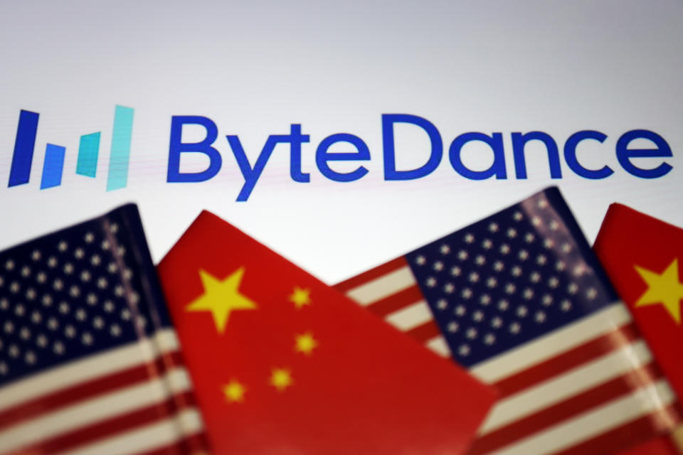 Flags of China and U.S. are seen near a Bytedance logo in this illustration picture taken September 18, 2020. REUTERS/Florence Lo/Illustration