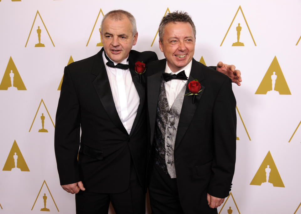 Philip George, left, and Gifford Hooper, developers of the Helicam miniature helicopter camera system and recipients of Technical Achievement Awards, pose together at the Academy of Motion Picture Arts and Sciences' annual Scientific and Technical Awards on Saturday, Feb. 15, 2014, in Beverly Hills, Calif. (Photo by Chris Pizzello/Invision/AP)