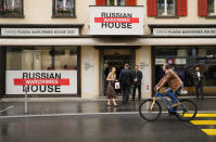 People gather in front of the so-called Russian War Crimes House alongside the World Economy Forum in Davos, Switzerland, Sunday, May 22, 2022. An exhibition with pictures documenting suspected Russian war crimes in the Ukrainian war are to be shown in the house. The annual meeting of the World Economy Forum is taking place in Davos from May. 22 until May. 26, 2020. (AP Photo/Markus Schreiber)