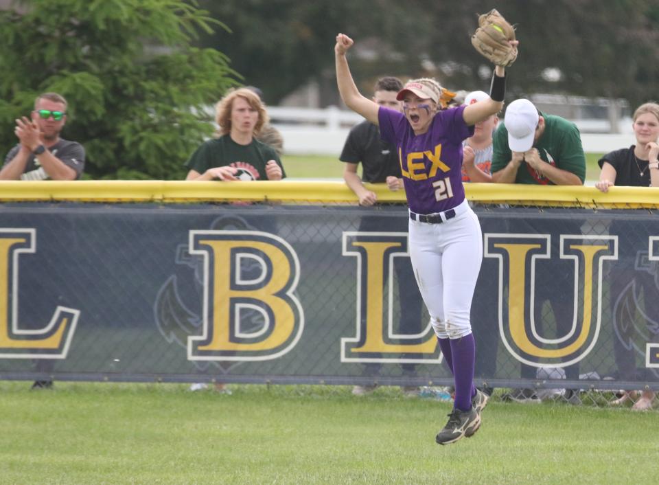 Lexington's Sydni Clever celebrates a spectacular catch in center field during the Division II regional championship game.