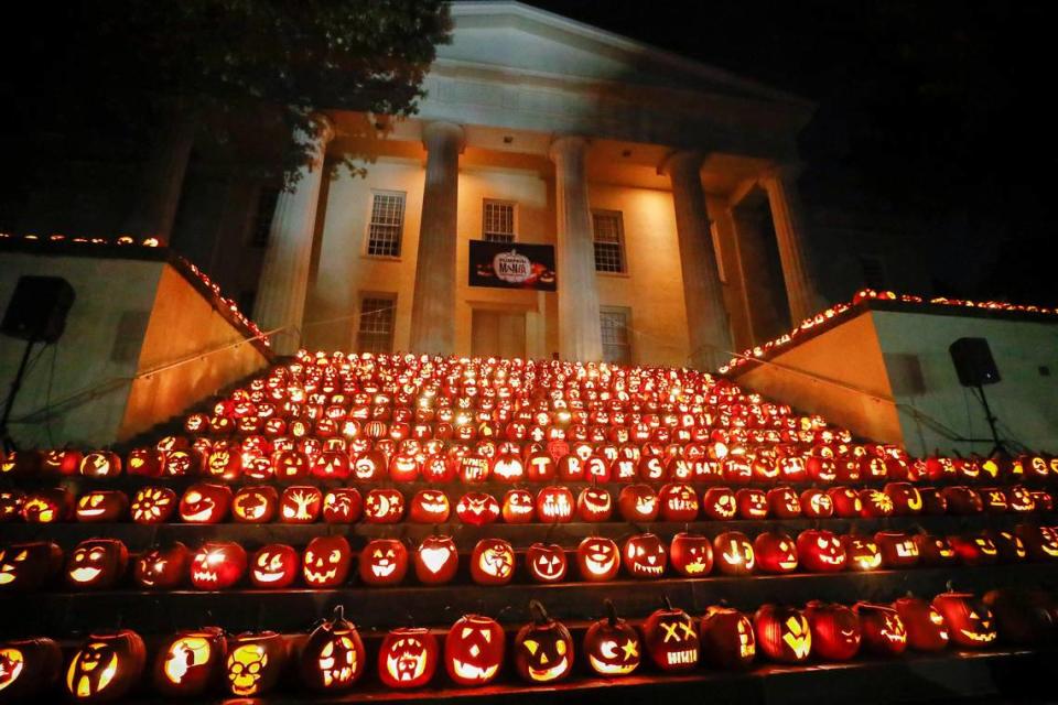 About 650 jack-o’-lanterns sit on display during PumpkinMania on the steps of the Old Morrison building at Transylvania University in Lexington, Ky., 2019. You can come carve one for the display, which opens Oct. 29.