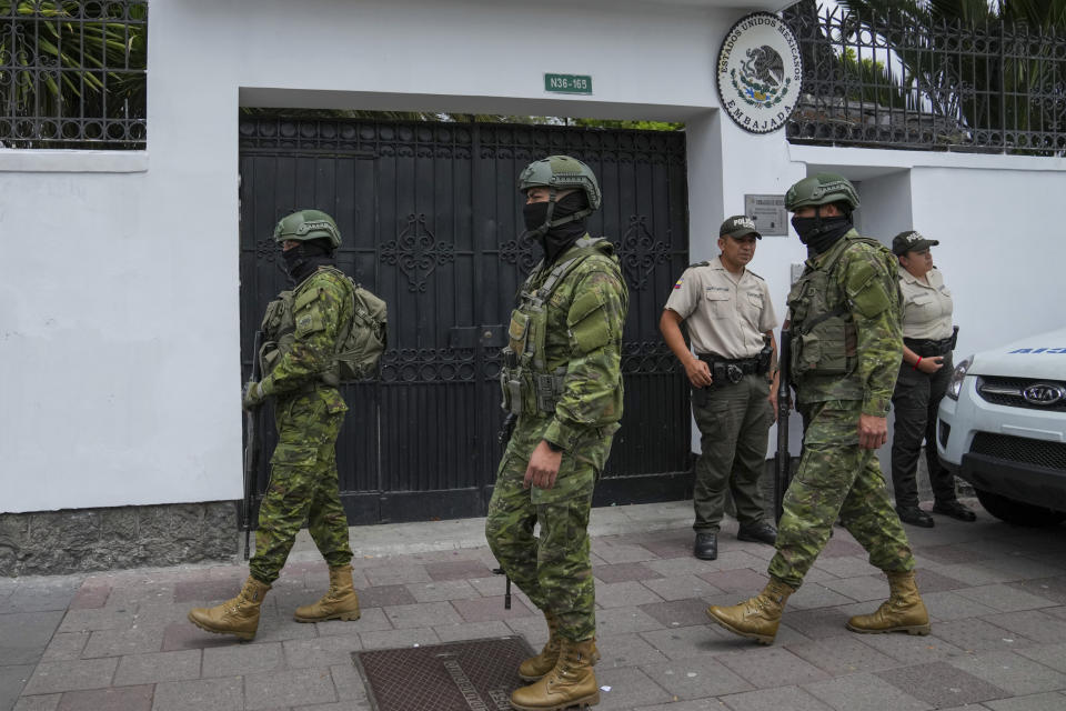 Soldiers and police stand guard outside the Mexican embassy, in Quito, Ecuador, Friday, April 5, 2024. Ecuador on Thursday declared Mexico's ambassador to Quito persona non grata due to recent statements made by Mexican President Andres Manuel Lopez Obrador regarding Ecuador's 2023 presidential elections. (AP Photo/Dolores Ochoa)