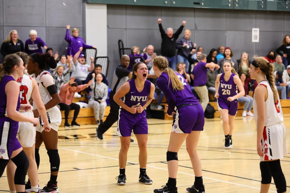 Belle Pellecchia (left), of Mendham, N.J., and Natalie Bruns (right) of the New York University women's basketball team celebrate at a recent game.