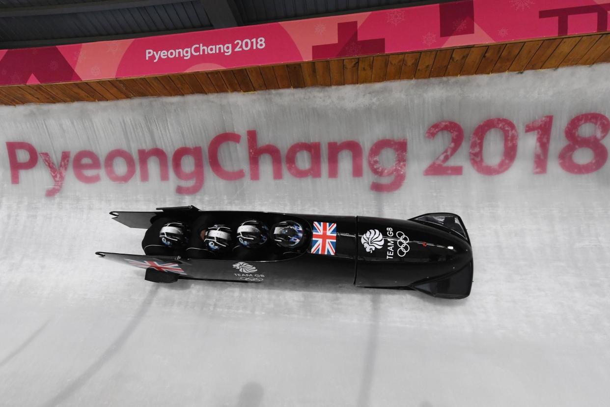 Hold tight: Lamin Deen, a Grenadier Guardsman, pilots Great Britain’s Nixon 64 on a training run in PyeongChang: AFP/Getty Images