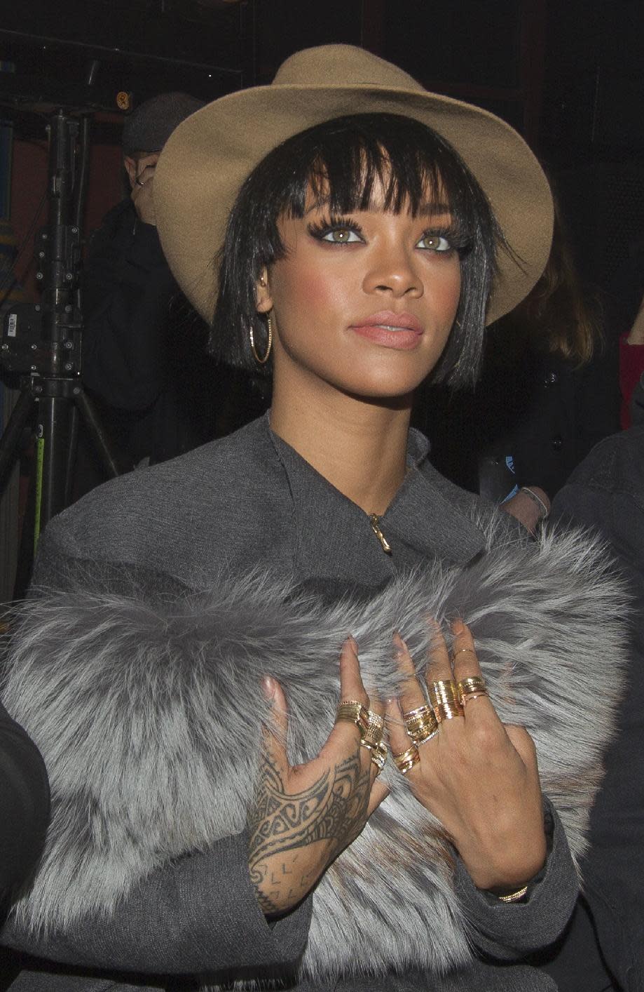 Rihanna attends the Lanvin ready-to-wear fall/winter 2014-2015 fashion collection presented in Paris,Thursday, Feb. 27, 2014. (AP Photo/Jacques Brinon)