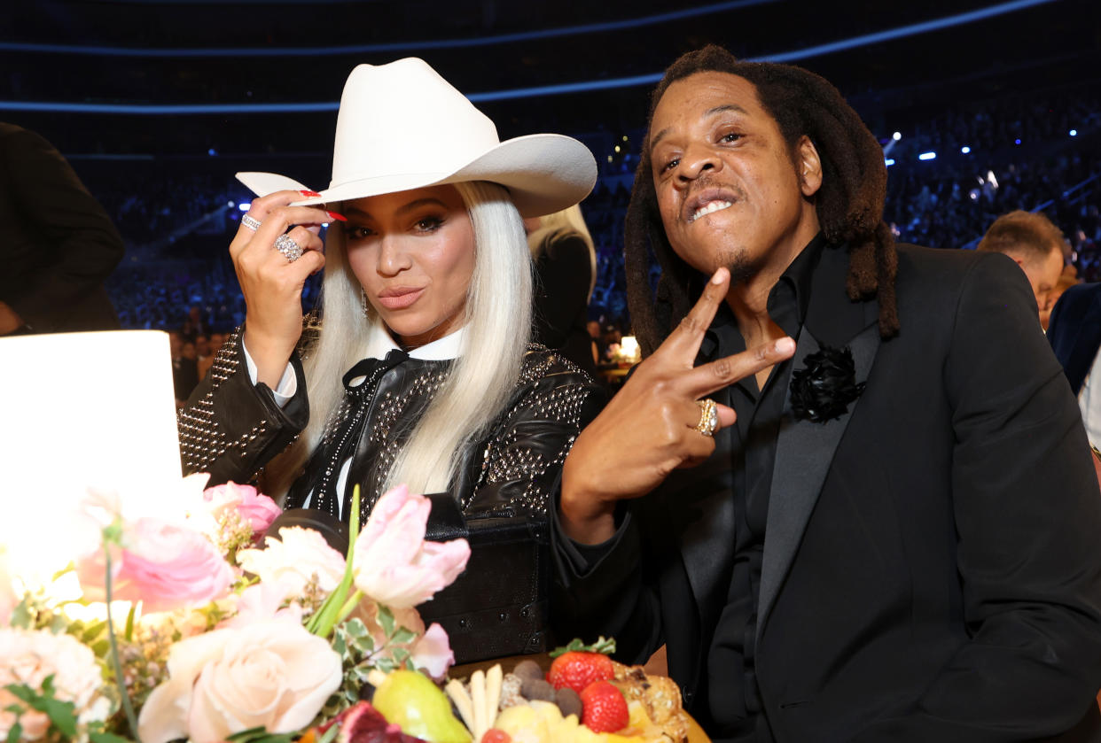 Beyoncé, in a cowboy hat, and Jay-Z attend the 66th GRAMMY Awards. 