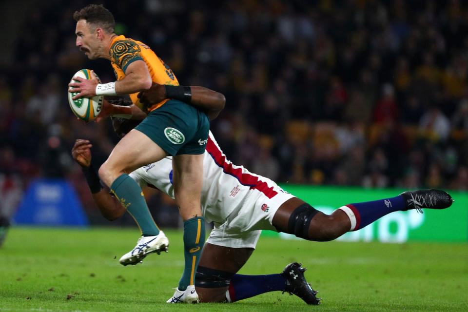 Australia’s Nic White, left, is tackled by England’s Maro Itoje (Tertius Pickard/AP) (AP)
