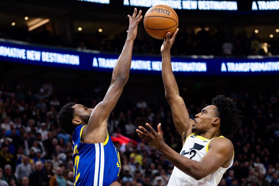 Utah Jazz guard Collin Sexton (2) shoots the ball with Golden State Warriors forward <a class="link " href="https://sports.yahoo.com/nba/players/5292/" data-i13n="sec:content-canvas;subsec:anchor_text;elm:context_link" data-ylk="slk:Andrew Wiggins;sec:content-canvas;subsec:anchor_text;elm:context_link;itc:0">Andrew Wiggins</a> (22) on defense during the NBA basketball game between the Utah Jazz and the Golden State Warriors at the Delta Center in Salt Lake City on Thursday, Feb. 15, 2024. | Megan Nielsen, Deseret News