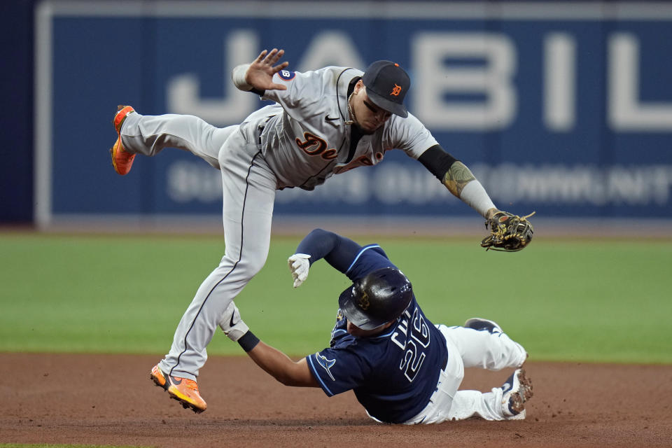 Tampa Bay Rays' Ji-Man Choi upends Detroit Tigers shortstop Javier Baez after being forced at second base on a fielder's choice by Randy Arozarena during the fourth inning of a baseball game Tuesday, May 17, 2022, in St. Petersburg, Fla. (AP Photo/Chris O'Meara)