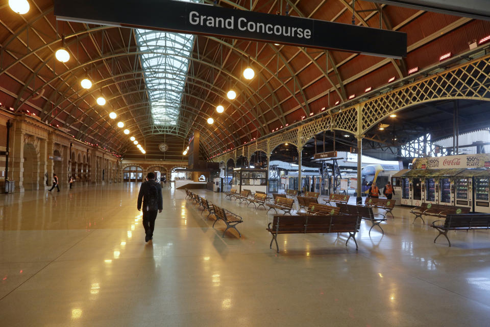 Central Station in Sydney, is near empty on Aug. 13, 2021 as greater Sydney continues a weeks-long COVID-19 lockdown. Japan, Australia and New Zealand all got through the first year of the coronavirus pandemic in relatively good shape, but now are taking very divergent paths in dealing with new outbreaks of the fast-spreading delta variant. (AP Photo/Rick Rycroft)