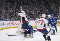 Washington Capitals' Alex Ovechkin, front left, celebrates his goal as Vancouver Canucks goalie Casey DeSmith (29) and Quinn Hughes, back right, watch during the second period of an NHL hockey game in Vancouver, British Columbia, Saturday, March 16, 2024. (Darryl Dyck/The Canadian Press via AP)