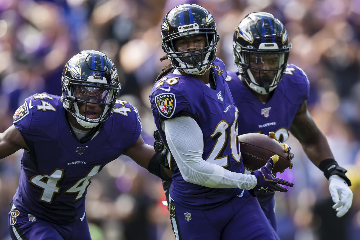 Maurice Canady #26 of the Baltimore Ravens celebrates with Chris Board #49 and Marlon Humphrey #44