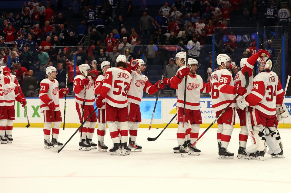 Detroit Red Wings goaltender Alex Lyon celebrates with teammates after they beat the Tampa Bay Lightning at Amalie Arena in Tampa, Florida on April 1, 2024.
