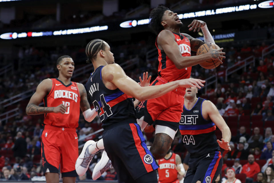 Houston Rockets guard Jalen Green, top right, loses the ball on a lay up between Detroit Pistons forwards Kevin Knox II and Bojan Bogdanovic as Jabari Smith Jr., left, looks on during the first half of an NBA basketball game, Monday, Jan. 1, 2024, in Houston. (AP Photo/Michael Wyke)