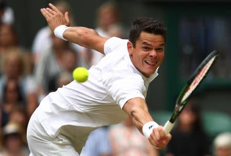 Britain Tennis - Wimbledon - All England Lawn Tennis & Croquet Club, Wimbledon, England - 8/7/16 Canada's Milos Raonic in action against Switzerland's Roger Federer REUTERS/Clive Brunskill/Pool