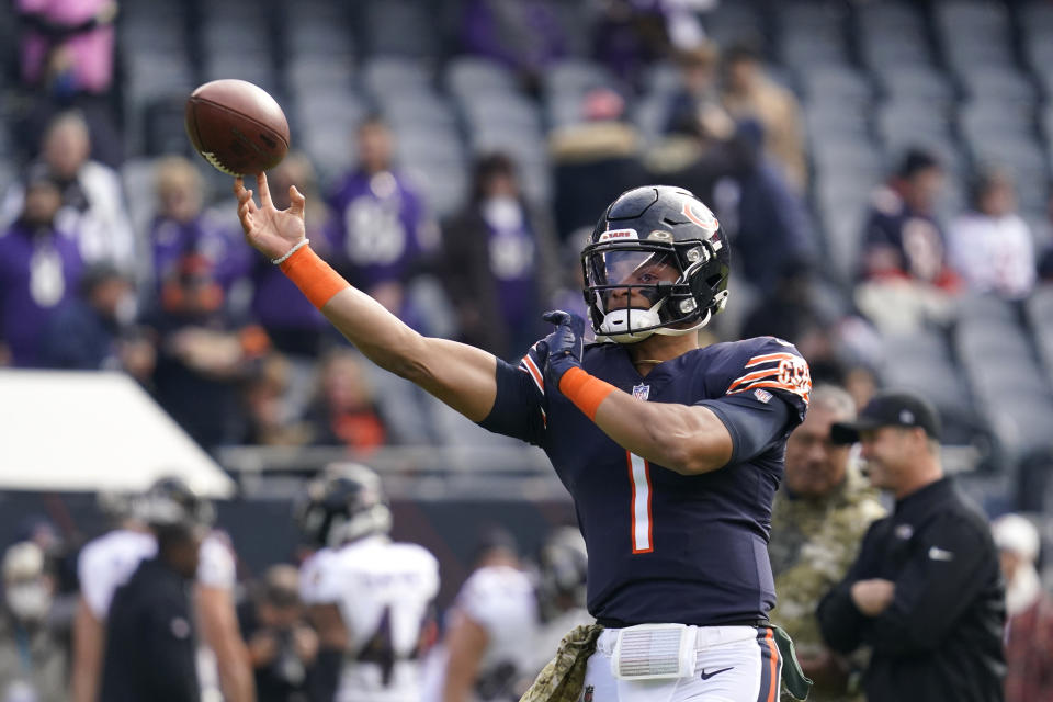 Chicago Bears quarterback Justin Fields warms up before an NFL football game against the Baltimore Ravens Sunday, Nov. 21, 2021, in Chicago. (AP Photo/Nam Y. Huh)