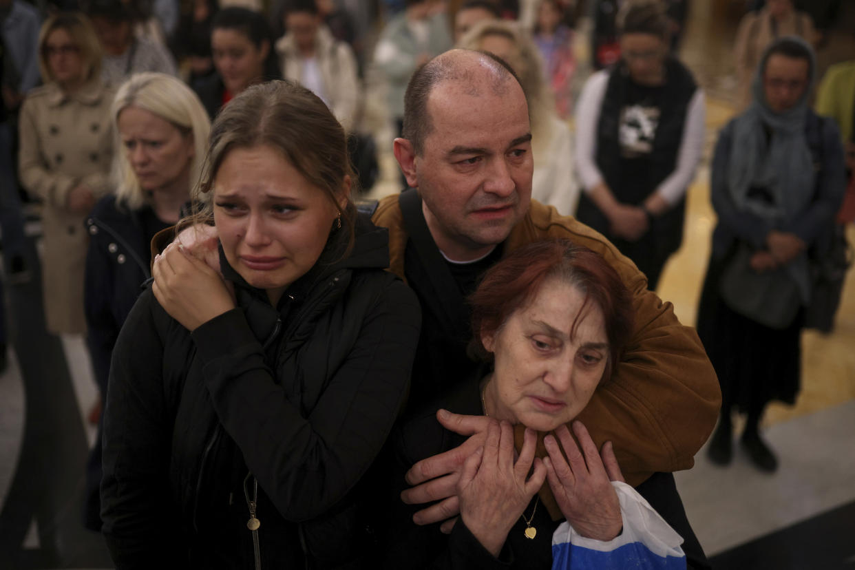 People mourn the victims at the St. Sava Serbian Orthodox temple in Belgrade, Serbia, Thursday, May 4, 2023. Hundreds of citizens gathered to pray for the victims, after a 13-year-old on Wednesday killed eight fellow students and a guard. (AP Photo/Armin Durgut)
