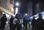 Hong Kong riot police stand on the streets of Hong Kong on Saturday, Sept. 21, 2019. Protesters in Hong Kong burned a Chinese flag and police fired pepper spray Saturday in renewed clashes over grievances by the anti-government demonstrators. (AP Photo/Vincent Yu)