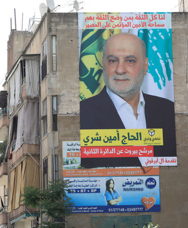 A campaign banner of Lebanese parliament candidate Amin Sherri hangs on a building in Beirut, Lebanon May 4, 2018. REUTERS/Jamal Saidi