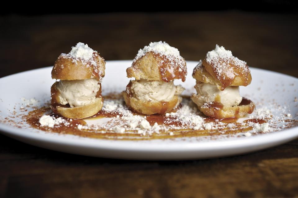 This undated image released by Le Pigeon shows foie gras profiteroles at Le Pigeon restaurant in Portland, Ore., where the rustic French-inspired food simply astounds. (AP Photo/Le Pigeon, David Reamer)