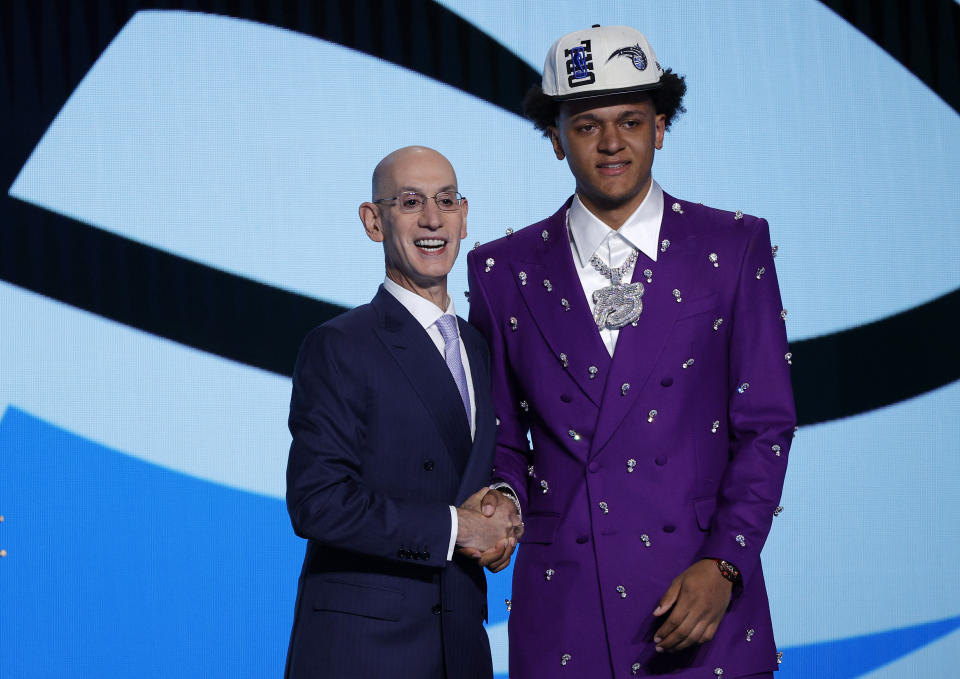 NBA commissioner Adam Silver and Paolo Banchero pose for photos after Banchero was drafted with the first overall pick by the Orlando Magic. (Photo by Sarah Stier/Getty Images)