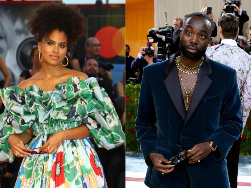 left: zazie beetz on a red carpet wearing large hoop earrings, her hair styled up, and a bright green, white, yellow and red dress with long sleeves and ruffles near the top; right: paapa essiedu on a red carpet, wearing a blue, deep cut suit and gold neck jewelry, holding sunglasses in his hand