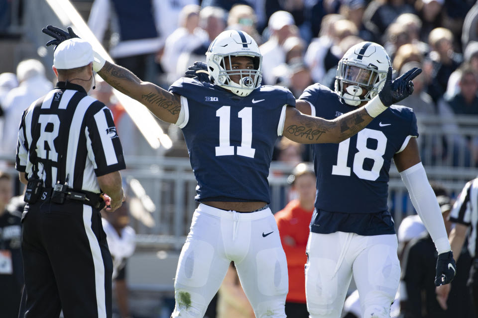 Penn State linebacker Micah Parsons (11) and defensive end Shaka Toney (18) celebrate a sack of Purdue quarterback Jack Plummer (13) in the second half of an NCAA college football game against Purdue in State College, Pa., on Saturday, Oct. 5, 2019. Penn State defeated Purdue 35-7. (AP Photo/Barry Reeger)