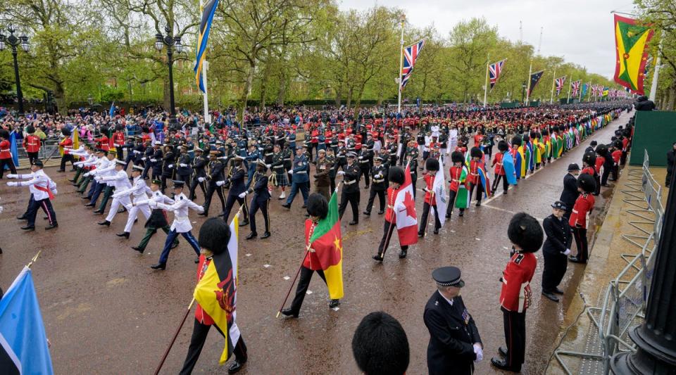 Troops march on the procession on the day of King Charles' coronation ceremony, in London. (via REUTERS)