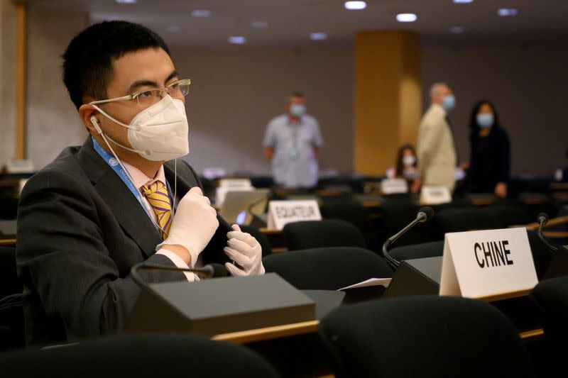 A Chinese delegate attends the resuming of a UN Human Rights Council session in Geneva