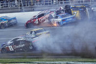 NASCAR Cup Series driver's Ryan Preece (41) Josh Berry (4) and Corey LaJoie (7) crash on the final lap during a NASCAR Cup Series auto race at Talladega Superspeedway, Sunday, April 21, 2024, in Talladega. Ala. (AP Photo/Butch Dill)