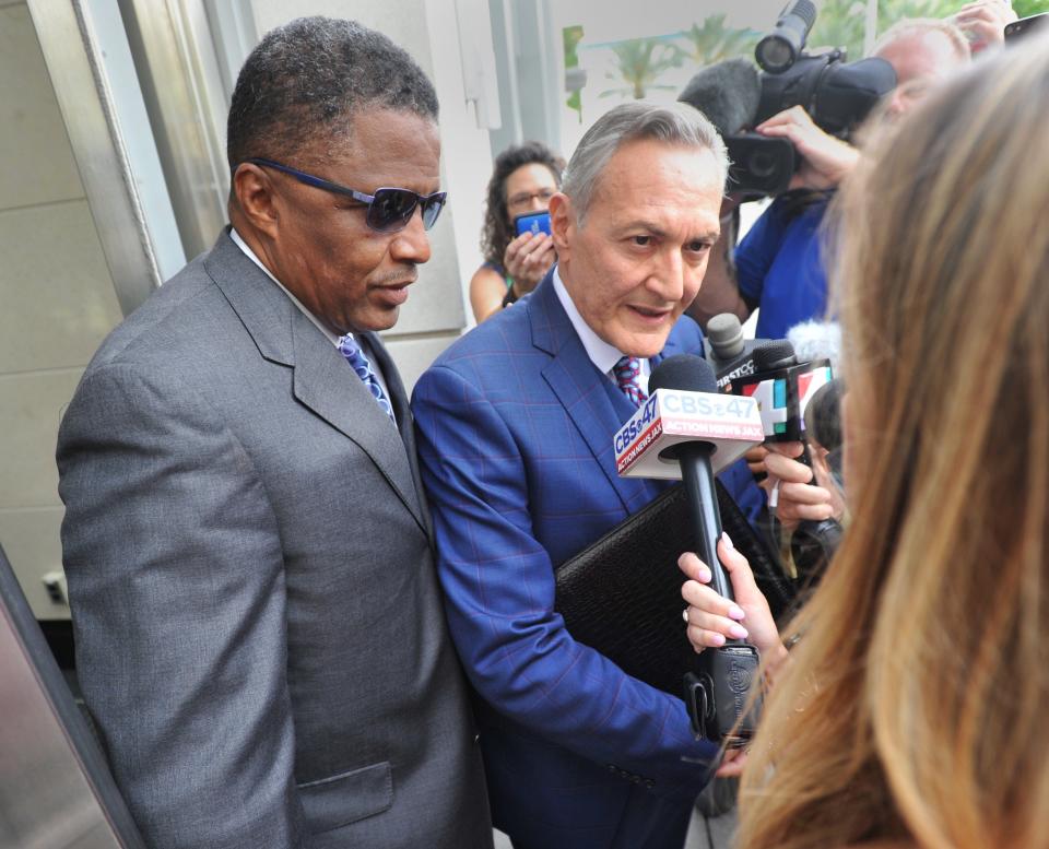 Defense attorney M. Alan Ceballos, shown addressing reporters outside Jacksonville's federal courthouse in 2018, has asked a judge to reject a prosecutor's argument that evidence showed former police office Josue Garriga had a "sexual interest in children."