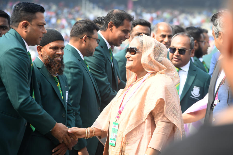 Bangladesh's Prime Minister Sheikh Hasina (C) greets the former players and captains of Bangladesh cricket team before the start of the first day of the second Test cricket match of a two-match series between India and Bangladesh at The Eden Gardens cricket stadium in Kolkata on November 22, 2019. (Photo by Dibyangshu SARKAR / AFP) / IMAGE RESTRICTED TO EDITORIAL USE - STRICTLY NO COMMERCIAL USE