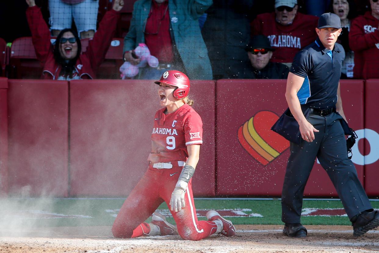Oklahoma catcher Kinzie Hansen (9) celebrated scoring during an NCAA softball game between the University of Oklahoma (OU) and Miami University on opening day of Oklahoma softball stadium Love's Field in Norman, Okla., on Friday, March 1, 2024.
